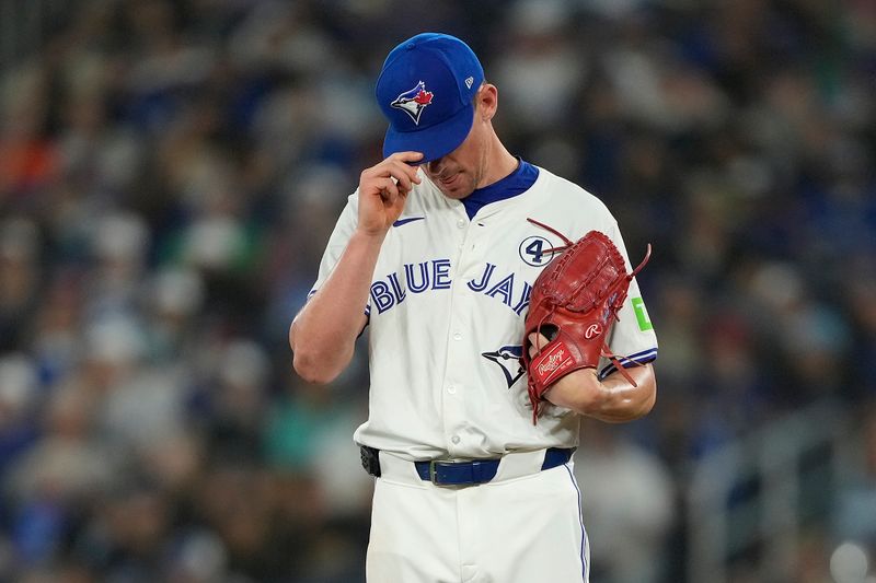 Jun 2, 2024; Toronto, Ontario, CAN; Toronto Blue Jays pitcher Chris Bassitt (40) reracts after hitting Pittsburgh Pirates right fielder Connor Joe with a pitch during the first inning at Rogers Centre. Mandatory Credit: John E. Sokolowski-USA TODAY Sports