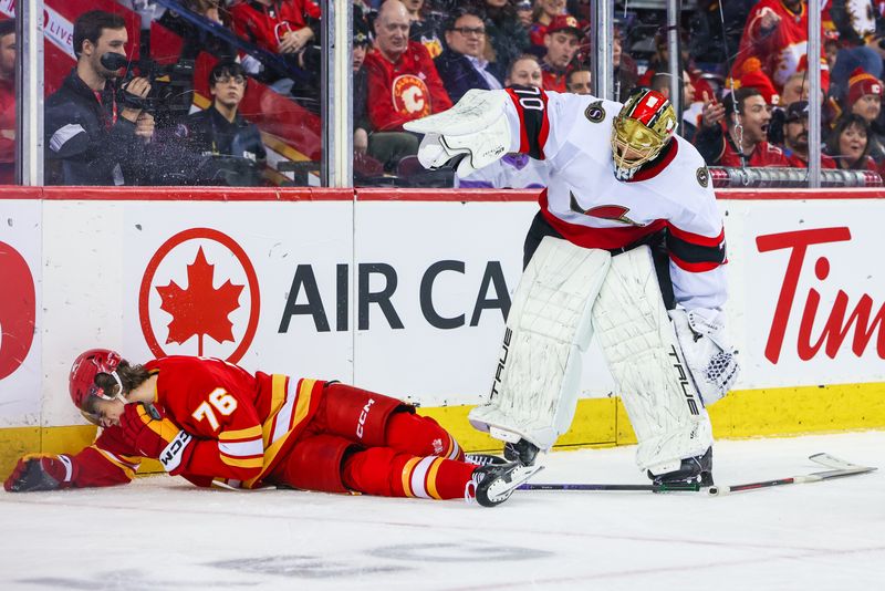 Jan 9, 2024; Calgary, Alberta, CAN; Ottawa Senators goaltender Joonas Korpisalo (70) and Calgary Flames center Martin Pospisil (76) collide during the second period at Scotiabank Saddledome. Mandatory Credit: Sergei Belski-USA TODAY Sports