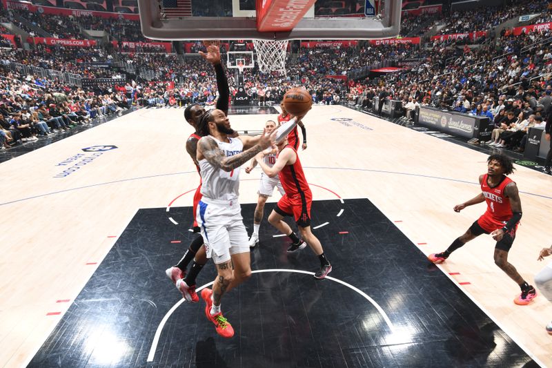 LOS ANGELES, CA - APIRL 14: Amir Coffey #7 of the LA Clippers drives to the basket during the game against the Houston Rockets on April 14, 2024 at Crypto.Com Arena in Los Angeles, California. NOTE TO USER: User expressly acknowledges and agrees that, by downloading and/or using this Photograph, user is consenting to the terms and conditions of the Getty Images License Agreement. Mandatory Copyright Notice: Copyright 2024 NBAE (Photo by Adam Pantozzi/NBAE via Getty Images)