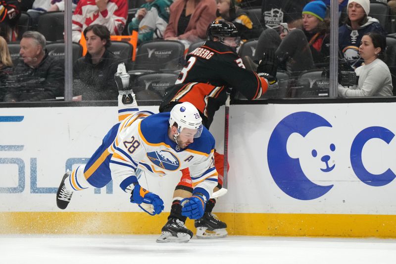 Feb 15, 2023; Anaheim, California, USA; Buffalo Sabres left wing Zemgus Girgensons (28) collides with Anaheim Ducks defenseman John Klingberg (3) in the first period at Honda Center. Mandatory Credit: Kirby Lee-USA TODAY Sports