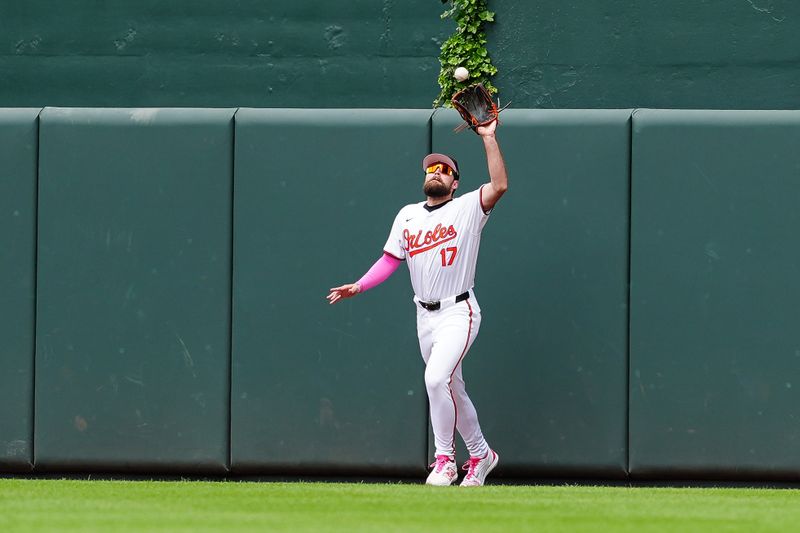 May 12, 2024; Baltimore, Maryland, USA; Baltimore Orioles center fielder Colton Cowser (17) catches a fly ball hit by Arizona Diamondbacks first baseman Christian Walker (not pictured) during the fourth inning at Oriole Park at Camden Yards. Mandatory Credit: Gregory Fisher-USA TODAY Sports