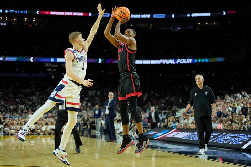 Apr 3, 2023; Houston, TX, USA; San Diego State Aztecs guard Micah Parrish (3) shoots the ball against Connecticut Huskies guard Joey Calcaterra (3) during the second half in the national championship game of the 2023 NCAA Tournament at NRG Stadium. Mandatory Credit: Bob Donnan-USA TODAY Sports