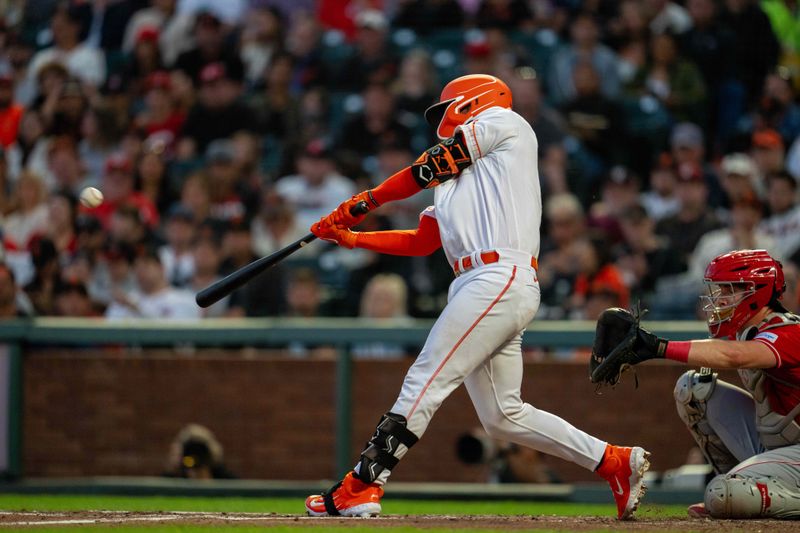 Aug 29, 2023; San Francisco, California, USA;  San Francisco Giants catcher Patrick Bailey (14) hits a two-run home run during the third inning against the Cincinnati Reds at Oracle Park. Mandatory Credit: Neville E. Guard-USA TODAY Sports