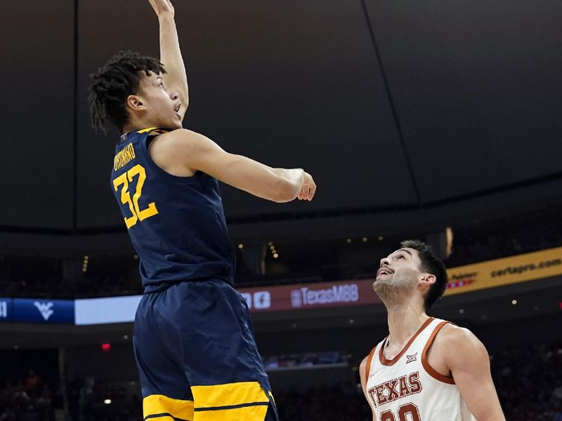 Feb 11, 2023; Austin, Texas, USA; West Virginia Mountaineers forward James Okonkwo (32) shoots over Texas Longhorns forward Brock Cunningham (30) during the second half at Moody Center. Mandatory Credit: Scott Wachter-USA TODAY Sports