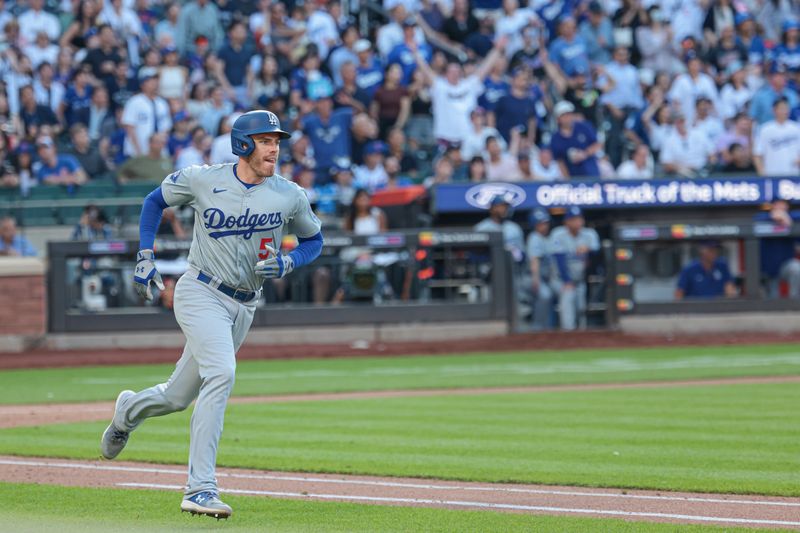 May 28, 2024; New York, NY, USA;  Los Angeles Dodgers first baseman Freddie Freeman (5) hits a two run home run during the tenth inning against the New York Mets at Citi Field. Mandatory Credit: Vincent Carchietta-USA TODAY Sports