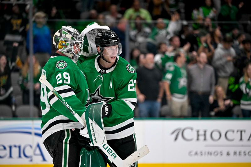 Oct 15, 2022; Dallas, Texas, USA; Dallas Stars goaltender Jake Oettinger (29) and defenseman Esa Lindell (23) celebrate the victory over the Nashville Predators at the American Airlines Center. Mandatory Credit: Jerome Miron-USA TODAY Sports