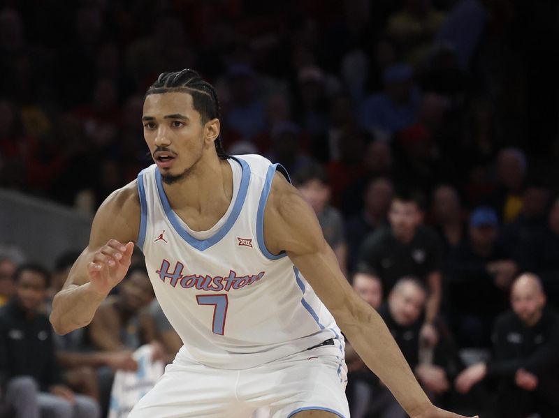 Jan 13, 2026; Houston, Texas, USA; Houston Cougars guard Milos Uzan (7) dribbles against West Virginia Mountaineers  in the second half at Fertitta Center. Mandatory Credit: Thomas Shea-Imagn Images