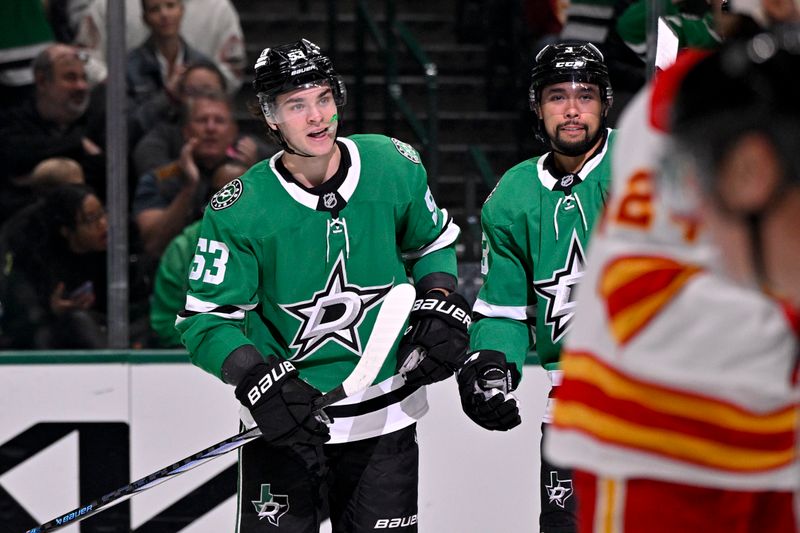 Mar 6, 2025; Dallas, Texas, USA; Dallas Stars center Wyatt Johnston (53) and defenseman Matt Dumba (3) skate off the ice after Johnston scores a goal against the Calgary Flames during the second period at the American Airlines Center. Mandatory Credit: Jerome Miron-Imagn Images