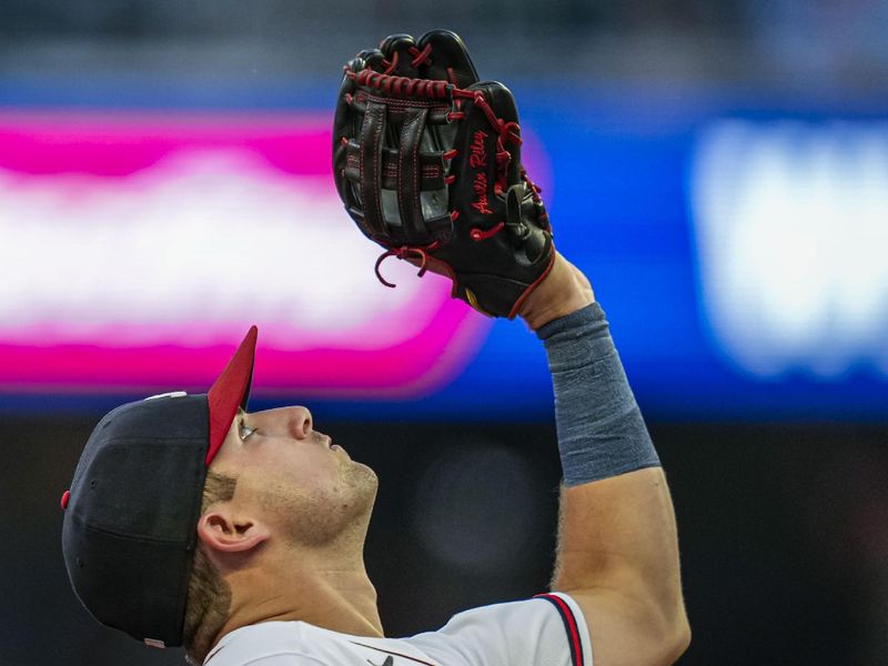 Aug 22, 2023; Cumberland, Georgia, USA; Atlanta Braves third baseman Austin Riley (27) catches a pop up hit by New York Mets center fielder Brandon Nimmo (9) (not shown) during the third inning at Truist Park. Mandatory Credit: Dale Zanine-USA TODAY Sports