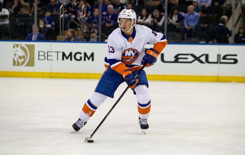 Sep 24, 2024; New York, New York, USA; New York Islanders center Mathew Barzal (13) looks to pass against the New York Rangers during the first period at Madison Square Garden. Mandatory Credit: Danny Wild-Imagn Images