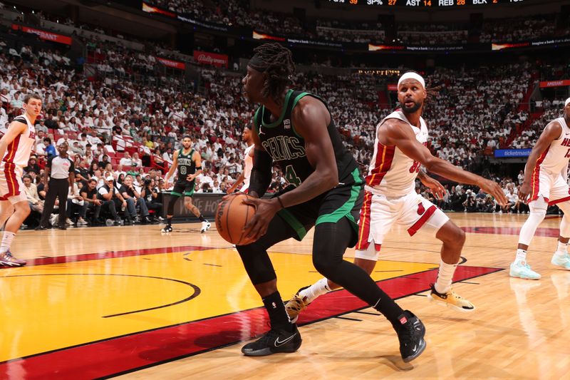 MIAMI, FL - APRIL 27: Jrue Holiday #4 of the Boston Celtics handles the ball during the game against the Miami Heat during Round 1 Game 3 of the 2024 NBA Playoffs on April 27, 2024 at Kaseya Center in Miami, Florida. NOTE TO USER: User expressly acknowledges and agrees that, by downloading and or using this Photograph, user is consenting to the terms and conditions of the Getty Images License Agreement. Mandatory Copyright Notice: Copyright 2024 NBAE (Photo by Issac Baldizon/NBAE via Getty Images)