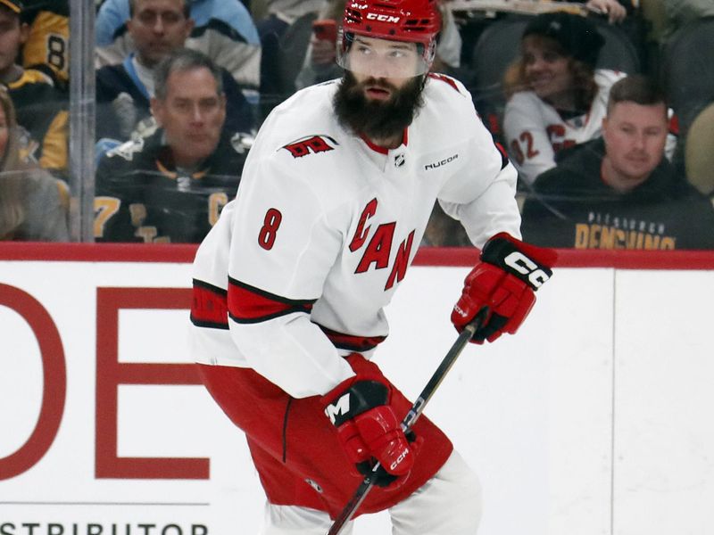 Mar 26, 2024; Pittsburgh, Pennsylvania, USA; Carolina Hurricanes defenseman Brent Burns (8) handles the puck against the Pittsburgh Penguins during the first period at PPG Paints Arena. Mandatory Credit: Charles LeClaire-USA TODAY Sports