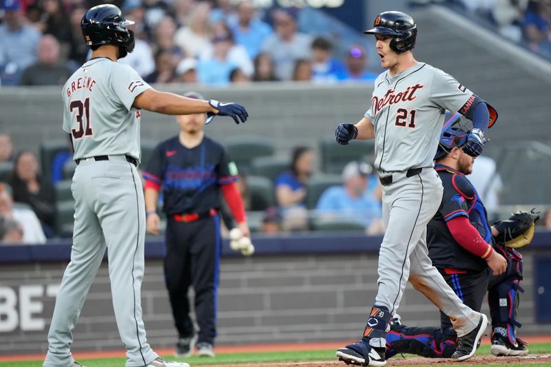 Jul 19, 2024; Toronto, Ontario, CAN; Detroit Tigers center fielder Riley Greene (31) goes to congratulate designated hitter Mark Canha (21) on his two run home run against the Toronto Blue Jays during the fourth inning at Rogers Centre. Mandatory Credit: John E. Sokolowski-USA TODAY Sports