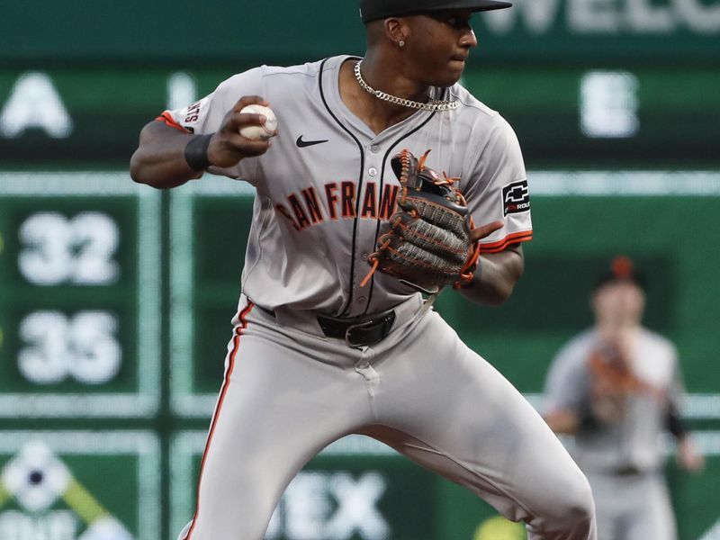 May 21, 2024; Pittsburgh, Pennsylvania, USA;  San Francisco Giants shortstop Marco Luciano (37) throws to first base after recording an out at second base against the Pittsburgh Pirates during the fifth inning at PNC Park. Mandatory Credit: Charles LeClaire-USA TODAY Sports