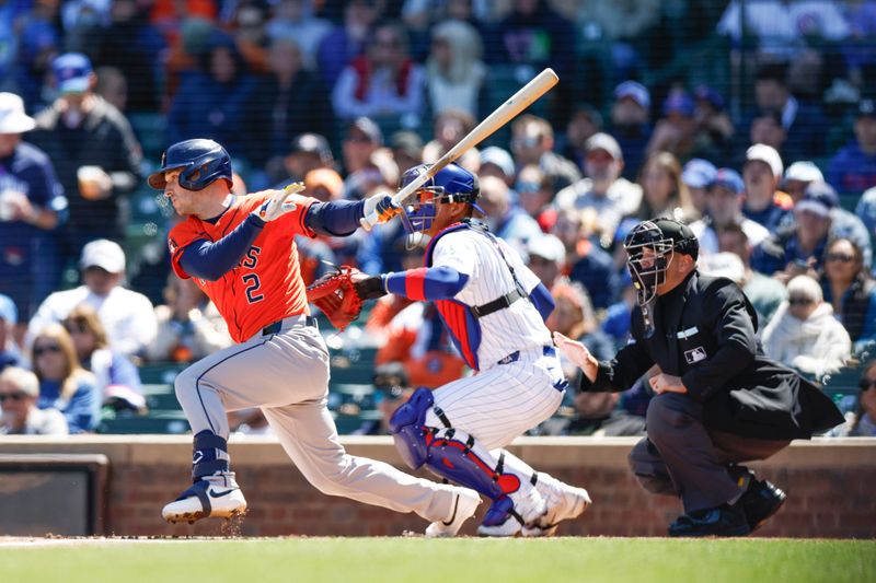 Apr 25, 2024; Chicago, Illinois, USA; Houston Astros third baseman Alex Bregman (2) singles against the Chicago Cubs during the first inning at Wrigley Field. Mandatory Credit: Kamil Krzaczynski-USA TODAY Sports