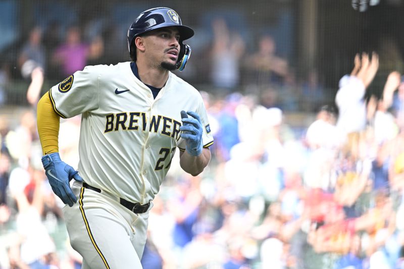 Jun 12, 2024; Milwaukee, Wisconsin, USA; Milwaukee Brewers shortstop Willy Adames (27) hits a home run against the Toronto Blue Jays in the sixth inning at American Family Field. Mandatory Credit: Michael McLoone-USA TODAY Sports