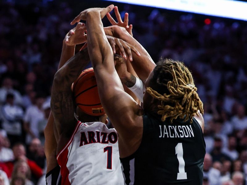 Jan 27, 2025; Tucson, Arizona, USA; Iowa States Cyclones center Dishon Jackson (1) blocks a shot made by Arizona Wildcats guard Caleb Love (1) during the second half at McKale Center. Mandatory Credit: Aryanna Frank-Imagn Images