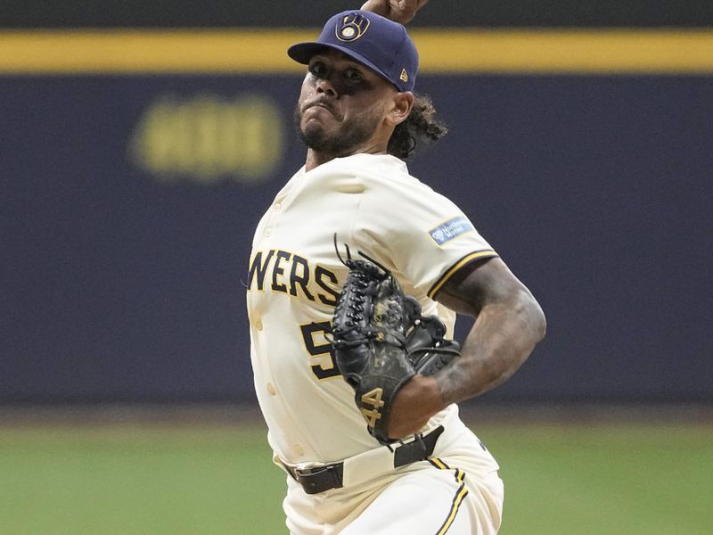 May 28, 2024; Milwaukee, Wisconsin, USA;  Milwaukee Brewers pitcher Freddy Peralta (51) throws a pitch during the first inning against the Chicago Cubs at American Family Field. Mandatory Credit: Jeff Hanisch-USA TODAY Sports