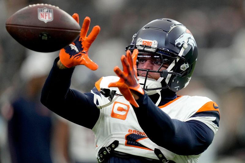 Denver Broncos cornerback Pat Surtain II warms prior to an an NFL football game against the Las Vegas Raiders, Sunday, Nov. 24, 2024, in Las Vegas. (AP Photo/John Locher)