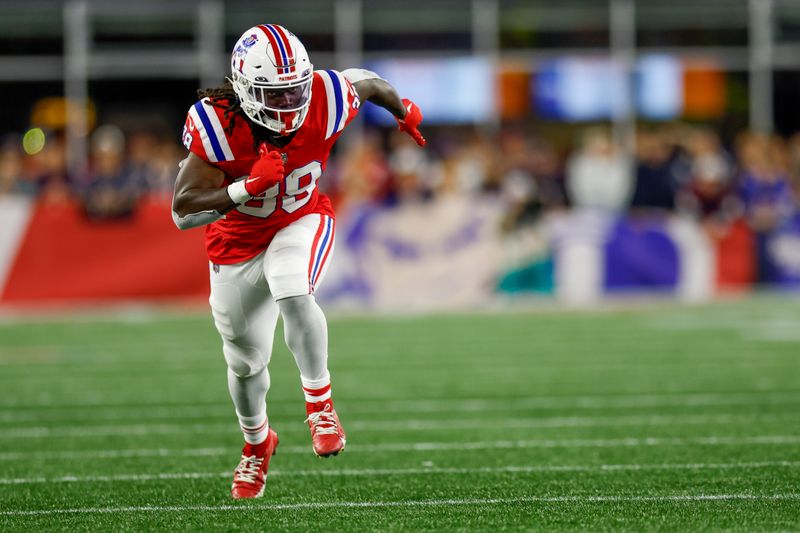 New England Patriots running back Rhamondre Stevenson (38) runs during the first half of an NFL football game against the Miami Dolphins on Sunday, Sept. 17, 2023, in Foxborough, Mass. (AP Photo/Greg M. Cooper)