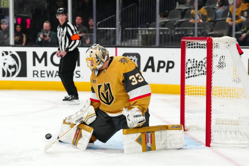 Jan 26, 2025; Las Vegas, Nevada, USA; Vegas Golden Knights goaltender Adin Hill (33) makes a save against the Florida Panthers during the first period at T-Mobile Arena. Mandatory Credit: Stephen R. Sylvanie-Imagn Images