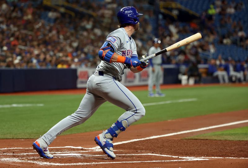 May 3, 2024; St. Petersburg, Florida, USA;  New York Mets second base Jeff McNeil (1) singles against the Tampa Bay Rays during the second inning at Tropicana Field. Mandatory Credit: Kim Klement Neitzel-USA TODAY Sports