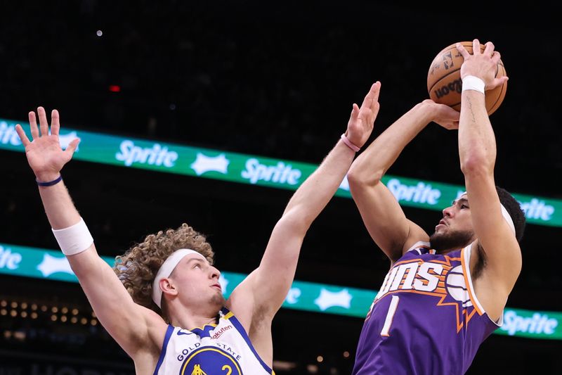 PHOENIX, ARIZONA - NOVEMBER 30: Devin Booker #1 of the Phoenix Suns attempts a shot over Brandin Podziemski #2 of the Golden State Warriors during the first half at Footprint Center on November 30, 2024 in Phoenix, Arizona. NOTE TO USER: User expressly acknowledges and agrees that, by downloading and or using this photograph, User is consenting to the terms and conditions of the Getty Images License Agreement.  (Photo by Chris Coduto/Getty Images)