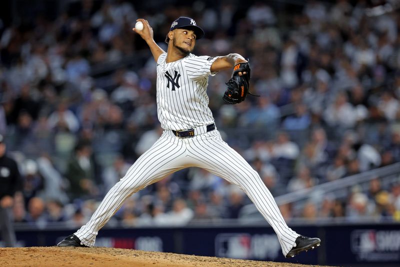 Oct 8, 2025; Bronx, New York, USA; New York Yankees pitcher Camilo Doval (75) pitches during the eighth inning against the Toronto Blue Jays during game four of the ALDS round for the 2025 MLB playoffs at Yankee Stadium. Mandatory Credit: Brad Penner-Imagn Images