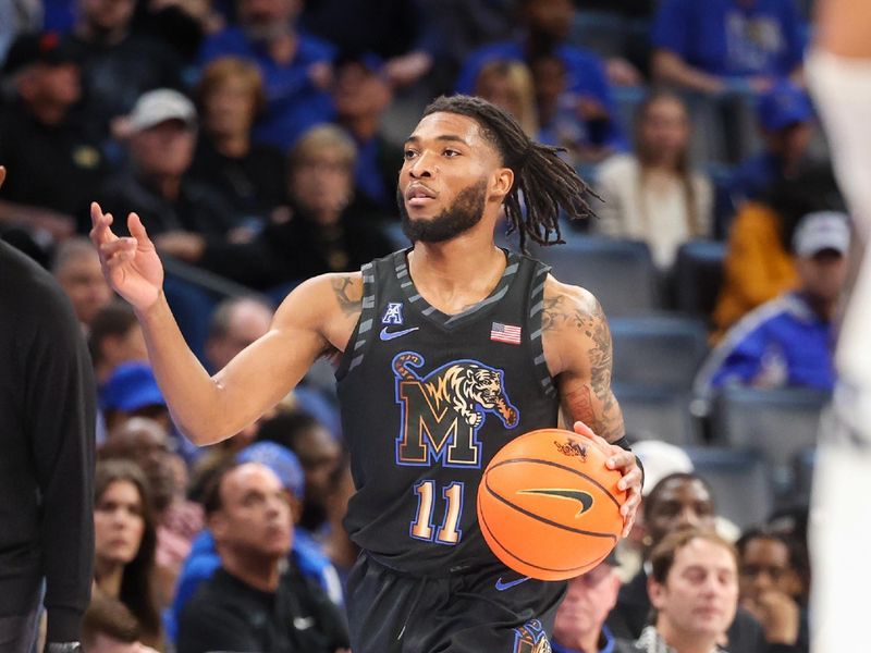 Feb 26, 2025; Memphis, Tennessee, USA; Memphis Tigers guard Tyrese Hunter (11) handles the ball against the Rice Owls during the first half at FedExForum. Mandatory Credit: Wesley Hale-Imagn Images