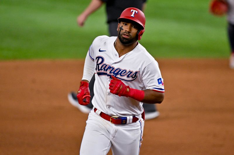 May 16, 2023; Arlington, Texas, USA; Texas Rangers shortstop Ezequiel Duran (20) rounds the bases after he hits a home run against the Atlanta Braves during the eighth inning at Globe Life Field. Mandatory Credit: Jerome Miron-USA TODAY Sports