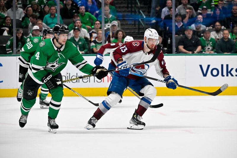 May 9, 2024; Dallas, Texas, USA; Dallas Stars defenseman Miro Heiskanen (4) and Colorado Avalanche right wing Valeri Nichushkin (13) look for the puck in the Stars zone during the third period in game two of the second round of the 2024 Stanley Cup Playoffs at American Airlines Center. Mandatory Credit: Jerome Miron-USA TODAY Sports