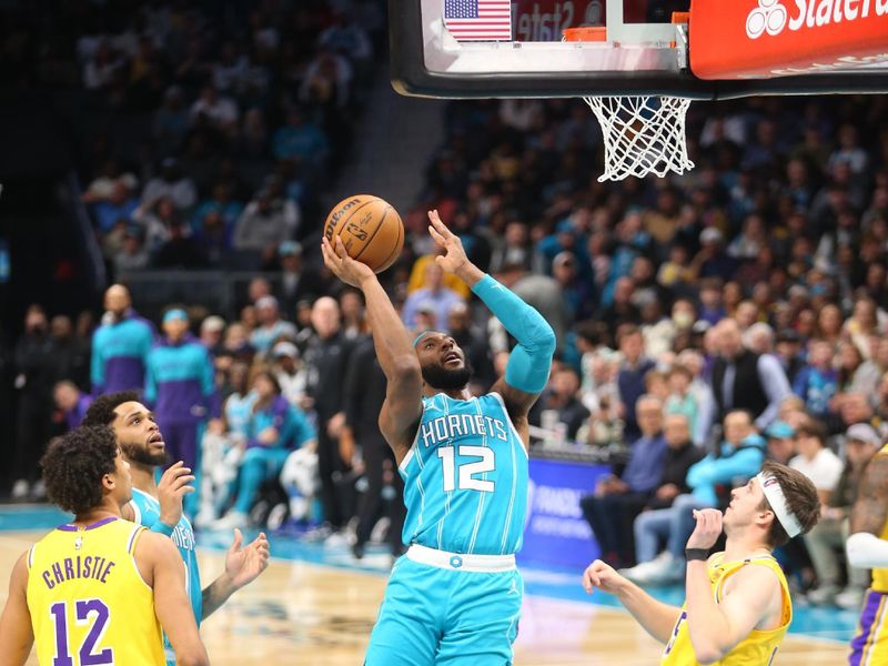 CHARLOTTE, NC - JANUARY 27:  Josh Okogie #12 of the Charlotte Hornets shoots the ball during the game against the Los Angeles Lakers on January 27, 2025 at Spectrum Center in Charlotte, North Carolina. NOTE TO USER: User expressly acknowledges and agrees that, by downloading and or using this photograph, User is consenting to the terms and conditions of the Getty Images License Agreement. Mandatory Copyright Notice: Copyright 2025 NBAE (Photo by Kent Smith/NBAE via Getty Images)