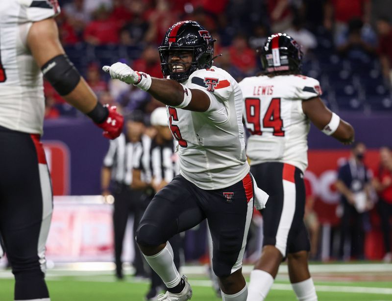 Sep 4, 2021; Houston, Texas, USA; Texas Tech Red Raiders linebacker Riko Jeffers (6) celebrates after returning an interception for a touchdown during the third quarter against the Houston Cougars at NRG Stadium. Mandatory Credit: Troy Taormina-USA TODAY Sports