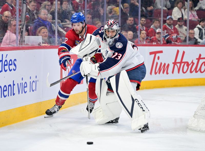 Mar 26, 2026; Montreal, Quebec, CAN; Columbus Blue Jackets goalie Jet Greaves (73) plays the puck and Montreal Canadiens forward Josh Anderson (17) pressures during the second period at the Bell Centre. Mandatory Credit: Eric Bolte-Imagn Images