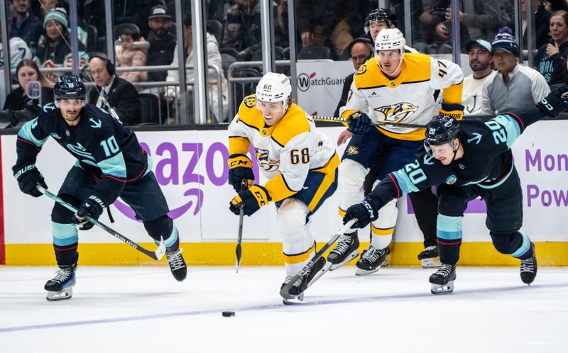 Nov 20, 2024; Seattle, Washington, USA;  Nashville Predators forward Zachary L'Heureux (68) skates against  forward Matty Beniers (10) and forward Eeli Tolvanen (20) during the third period at Climate Pledge Arena. Mandatory Credit: Stephen Brashear-Imagn Images