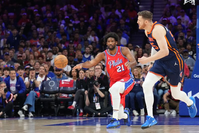 PHILADELPHIA, PA - APRIL 28: Joel Embiid #21 of the Philadelphia 76ers passes the ball during the game against the New York Knicks during Round 1 Game 4 of the 2024 NBA Playoffs on April 28, 2024 at the Wells Fargo Center in Philadelphia, Pennsylvania NOTE TO USER: User expressly acknowledges and agrees that, by downloading and/or using this Photograph, user is consenting to the terms and conditions of the Getty Images License Agreement. Mandatory Copyright Notice: Copyright 2024 NBAE (Photo by Jesse D. Garrabrant/NBAE via Getty Images)