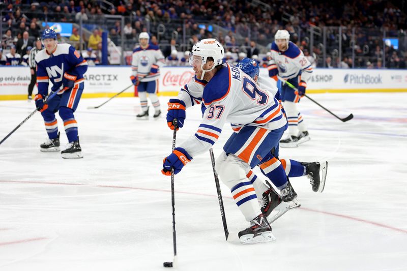 Dec 19, 2023; Elmont, New York, USA; Edmonton Oilers center Connor McDavid (97) skates with the puck against the New York Islanders during the third period at UBS Arena. Mandatory Credit: Brad Penner-USA TODAY Sports