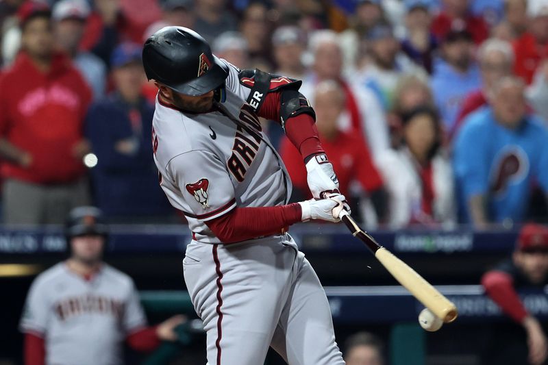 Oct 24, 2023; Philadelphia, Pennsylvania, USA; Arizona Diamondbacks first baseman Christian Walker (53) hits a RBI single against the Philadelphia Phillies in the first inning for game seven of the NLCS for the 2023 MLB playoffs at Citizens Bank Park. Mandatory Credit: Bill Streicher-USA TODAY Sports