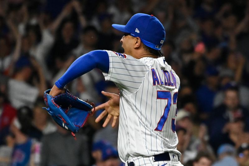 May 30, 2023; Chicago, Illinois, USA;  Chicago Cubs relief pitcher Adbert Alzolay (73) celebrates at the end of the game against the Tampa Bay Rays at Wrigley Field. Mandatory Credit: Matt Marton-USA TODAY Sports