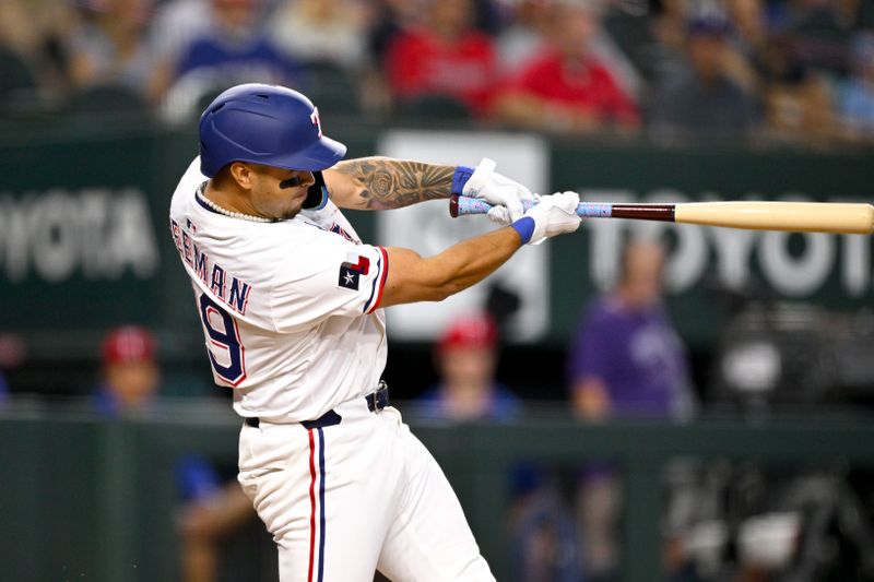 Aug 23, 2025; Arlington, Texas, USA; Texas Rangers second baseman Cody Freeman (39) hits his first career MLB home run during the second inning against the Cleveland Guardians at Globe Life Field. Mandatory Credit: Jerome Miron-Imagn Images