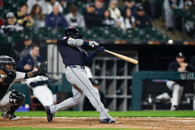 May 9, 2024; Chicago, Illinois, USA; Cleveland Guardians catcher Bo Naylor (23) singles against the Chicago White Sox during the fifth inning at Guaranteed Rate Field. Mandatory Credit: Kamil Krzaczynski-USA TODAY Sports