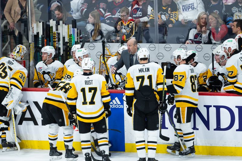 Feb 10, 2024; Winnipeg, Manitoba, CAN;  Pittsburgh Penguins assistant coach Todd Reirden discusses strategy against the Winnipeg Jets during the third period at Canada Life Centre. Mandatory Credit: Terrence Lee-USA TODAY Sports