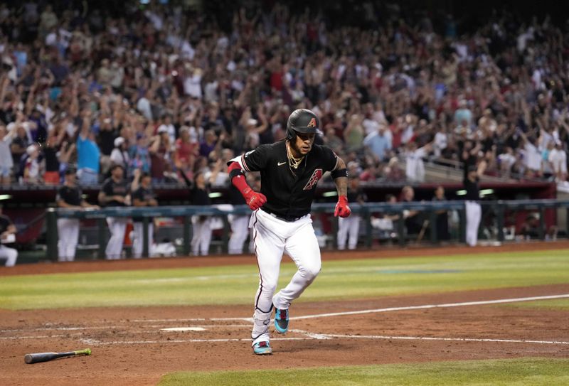 Aug 26, 2023; Phoenix, Arizona, USA; Arizona Diamondbacks second baseman Ketel Marte (4) flexes after hitting a three run home run against the Cincinnati Reds during the fifth inning at Chase Field. Mandatory Credit: Joe Camporeale-USA TODAY Sports