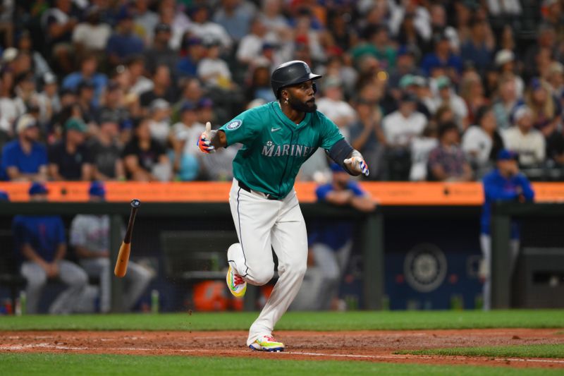 Aug 10, 2024; Seattle, Washington, USA; Seattle Mariners left fielder Randy Arozarena (56) hits a single against the New York Mets during the seventh inning at T-Mobile Park. Mandatory Credit: Steven Bisig-USA TODAY Sports