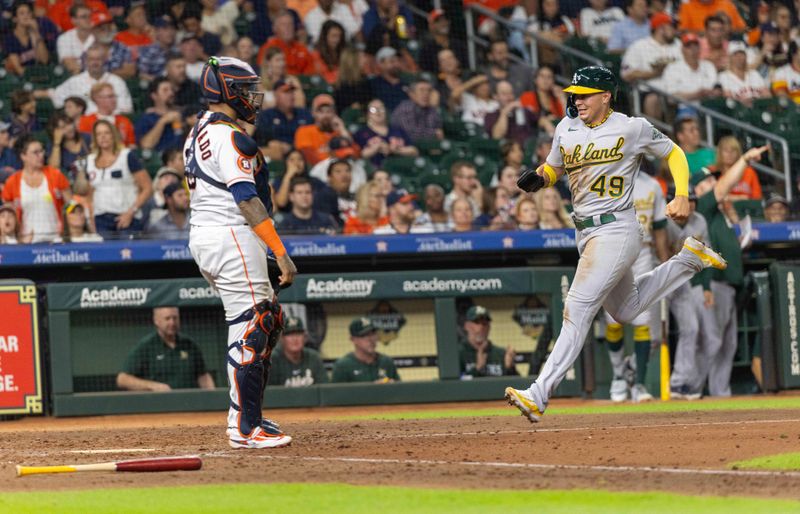 Sep 12, 2023; Houston, Texas, USA; Oakland Athletics first baseman Ryan Noda (49) scores against the Houston Astros in the eighth inning at Minute Maid Park. Mandatory Credit: Thomas Shea-USA TODAY Sports