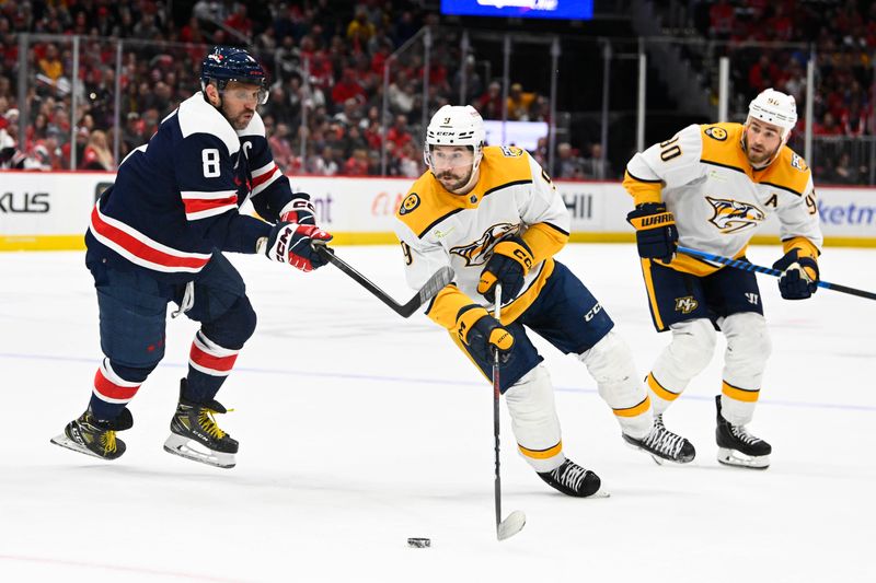 Dec 30, 2023; Washington, District of Columbia, USA; Nashville Predators left wing Filip Forsberg (9) advances the puck as Washington Capitals left wing Alex Ovechkin (8) defends during overtime at Capital One Arena. Mandatory Credit: Brad Mills-USA TODAY Sports