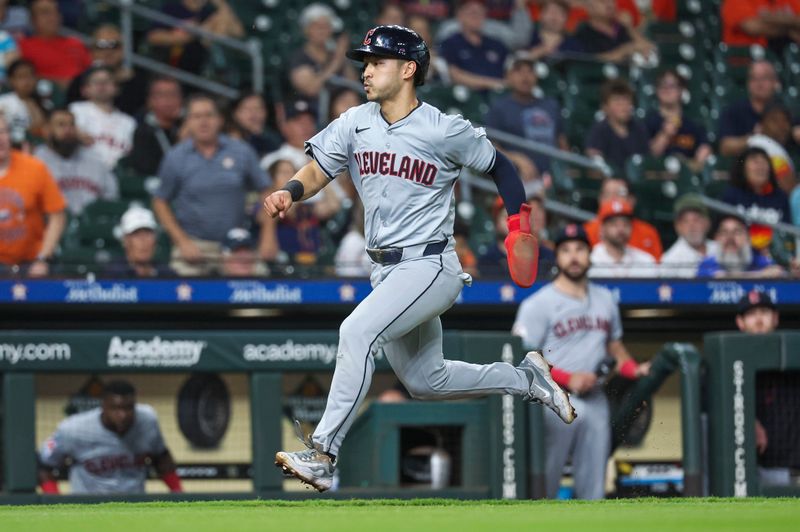 May 2, 2024; Houston, Texas, USA; Cleveland Guardians left fielder Steven Kwan (38) scores on a sacrifice fly ball during the third inning against the Houston Astros at Minute Maid Park. Mandatory Credit: Troy Taormina-USA TODAY Sports