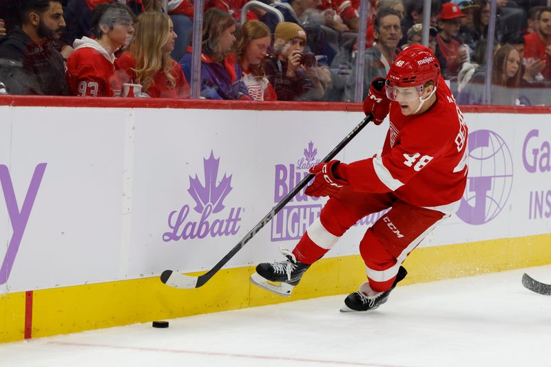 Nov 9, 2024; Detroit, Michigan, USA;  Detroit Red Wings right wing Jonatan Berggren (48) skates with the puck against the New York Rangers in the second period at Little Caesars Arena. Mandatory Credit: Rick Osentoski-Imagn Images