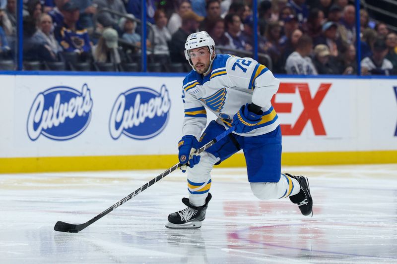 Dec 22, 2025; Tampa, Florida, USA; St. Louis Blues defenseman Justin Faulk (72) controls the puck against the Tampa Bay Lightning in the second period at Benchmark International Arena. Mandatory Credit: Nathan Ray Seebeck-Imagn Images