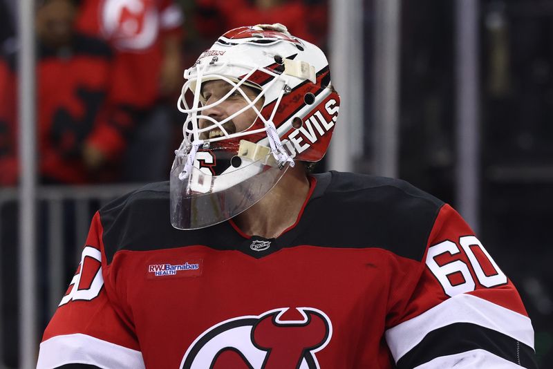 Sep 30, 2024; Newark, New Jersey, USA; New Jersey Devils goaltender Jeremy Brodeur (60) celebrates the Devils win over the New York Rangers at Prudential Center. Mandatory Credit: Ed Mulholland-Imagn Images